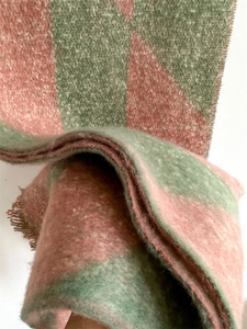 Detail of pink and green checkerboard scarf showing soft brushed cashmere-like texture