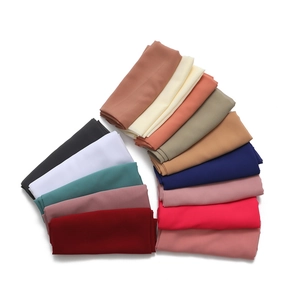 Chiffon hijab collection in multiple solid colors displayed in a fan-shaped arrangement