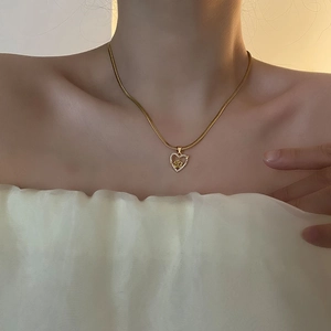 Elegant gold heart and rose pendant necklace with crystal inlay on a snake chain