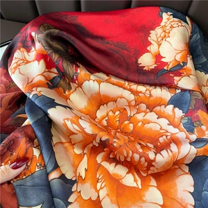 70cm satin silk square scarf featuring vibrant red floral patterns and elegant drape