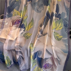 Elegant large silk scarf featuring realistic blue rose patterns on a sheer fabric shawl