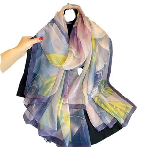 Artistic floral chiffon shawl with violet and blue patterns on a semi-transparent fabric