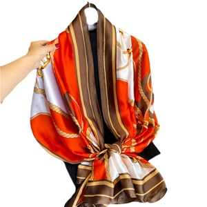 Elegant horse print silk scarf with orange and brown equestrian chain design