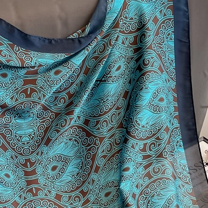 Blue paisley silk feel 110cm scarf featuring elegant patterns and smooth texture