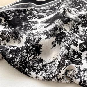 Detailed view of the soft toile de jouy forest print on twill silk square scarf fabric