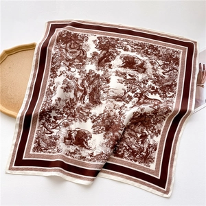 Macro detail of Toile de Jouy animal print on luxury satin square scarf