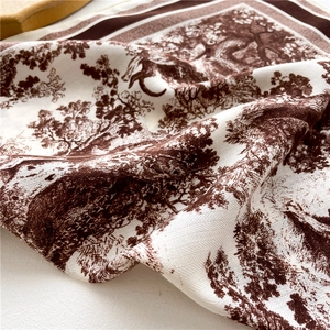 Detail of vintage brown Toile de Jouy pattern on premium twill silk scarf