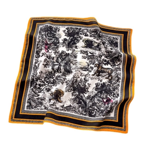 Square silk scarf with black wildlife animal print and orange borders on white background
