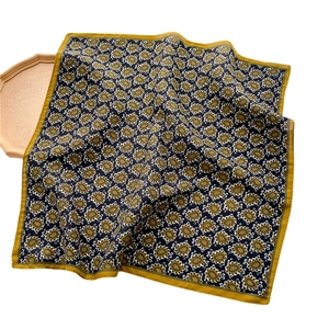 Elegant yellow paisley square silk scarf with herringbone texture for women, flat lay view