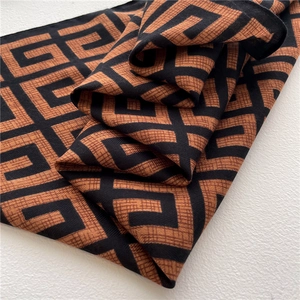 Close-up of geometric pattern and twill weave texture on luxury style shawl