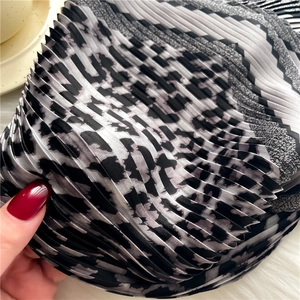 Leopard print pleated silk scarf for women featuring fine accordion fold texture