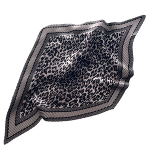 Pleated square silk scarf with classic leopard print pattern on white background