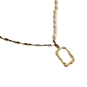 Titanium steel necklace with natural pearls and a textured gold geometric pendant