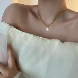 Elegant gold snake chain necklace featuring a white geometric turtle shell pendant for women
