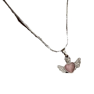 Silver necklace with pink heart pendant and sparkling angel wings on a plain background