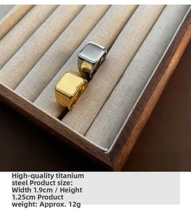 Detail view of gold and silver titanium steel square signet rings with dimensions and weight