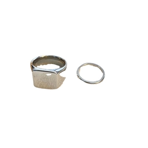 Minimalist silver-tone signet and thin band ring set in polished titanium steel