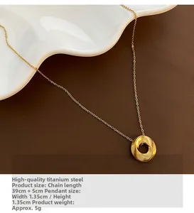 Golden Mobius pendant necklace made of titanium steel on deep brown background