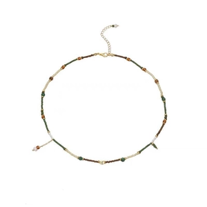 Retro beaded pearl necklace with dark green beads and gold hardware on white background