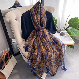 Elegant navy blue baroque floral silk scarf displayed as a long lightweight shawl pashmina