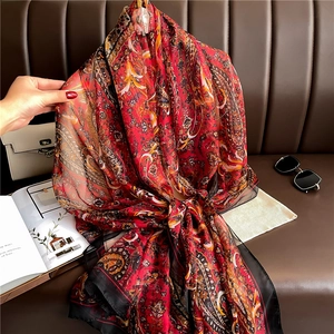 Lightweight red paisley silk scarf with sheer texture and elegant vintage pattern design