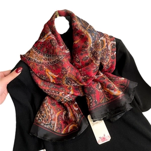 Deep red Paisley faux silk scarf with orange patterns and black borders for women