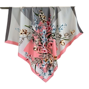 Elegant 90cm floral silk square scarf with pink and grey geometric patterns hanging