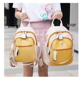 Size comparison between large and small yellow contrast color travel backpacks