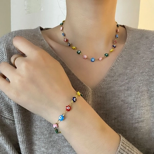 Parure bijoux fleurs colorées œil protecteur avec collier et bracelet plaqués or femme