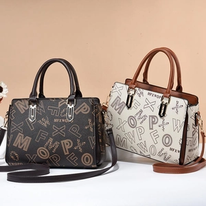 Fashionable monogram tote bag for women in brown and white leather with shoulder strap