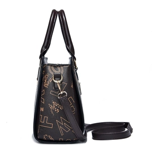 Fashionable brown and black tote bag with geometric M and F prints and gold hardware