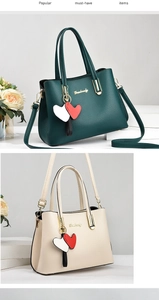 Close-up of lychee textured leather bags with heart charms and golden hardware