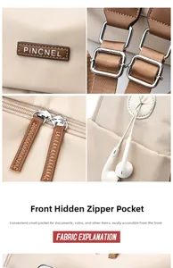 Detail of beige nylon backpack showing leather brand logo and practical earphone hole