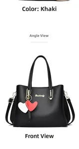 Front view of black pebbled leather handbag with gold logo and heart charms