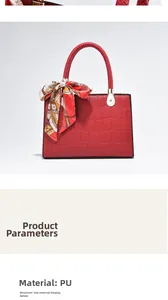 Detail of red crocodile texture PU leather handbag with elegant printed silk scarf handle