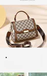 Detail of checkered brown and beige crossbody bag with adjustable wide fabric strap