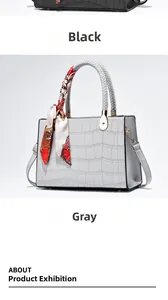 Close-up of crocodile pattern leather handbags with woven handles and silk scarf accents