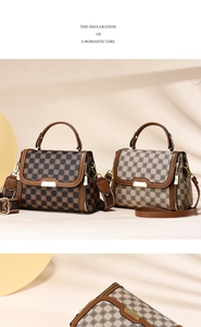 Detail of checkered pattern fashion handbags with golden hardware and leather straps