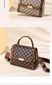 Detail of checkered shoulder bag with floral pattern and wide woven strap