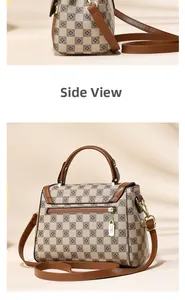 Detailed side view of a brown checkerboard crossbody bag with leather trim and gold hardware
