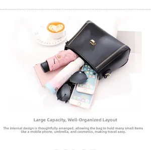 Large capacity shoulder bag showing organized layout with umbrella, phone and wallet