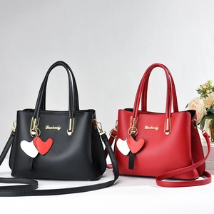 Stylish large capacity red and black leather handbags with heart charms and gold hardware