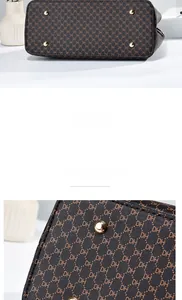 Dettaglio della base della borsa in pelle marrone con piedini in metallo dorato e motivo logo DH