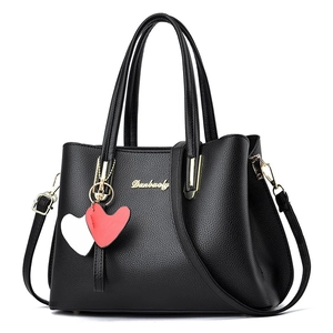 Black lychee texture tote bag with gold logo, heart charms and removable shoulder strap