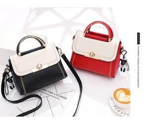 Detail of color-block handbags with V-stitch patterns and gold metal twist locks