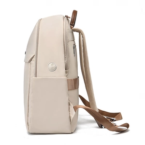 Lightweight cream nylon backpack for women with side pockets and brown leather accents