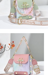 Detail of gradient crossbody bag with golden swan lock and pearl pendant decoration
