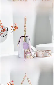 Detail of gradient crossbody mini bag with floral pattern and resin chain strap