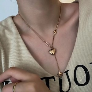 Rose gold layered necklace with heart 'Love' pendant and star charm for women