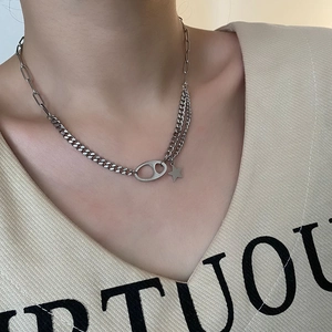 Silver titanium steel chain necklace with pig nose buckle and star pendant on model